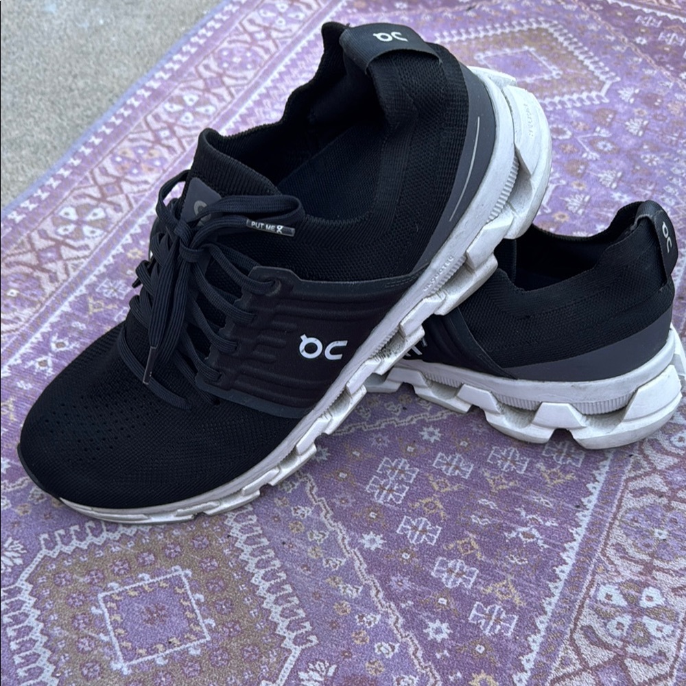 On Running Black and White Athletic Shoes with Cushioned Sole